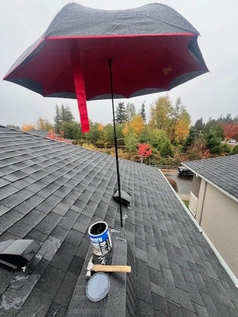 Close-up of SunSafe Shield umbrella shade attached to a Pitch Hopper on a shingle roof