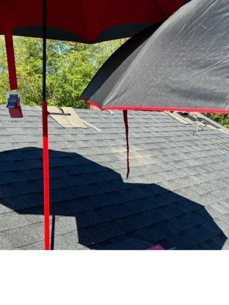 SunSafe Shield umbrella shades providing shade over a shingle roof work area